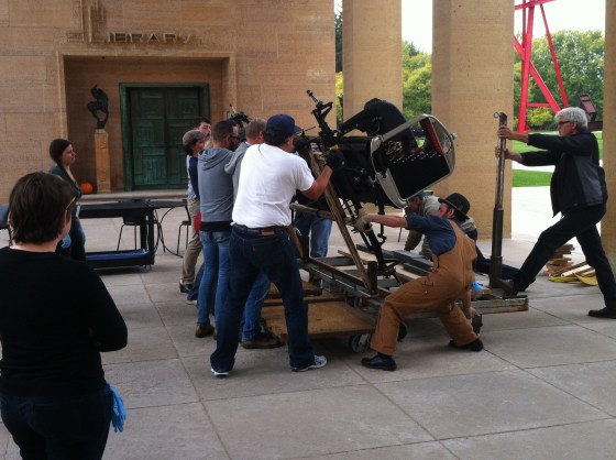 Tilting the Model T chassis right side up outside of the museum.  October 2013.  Shoshana Resnikoff/Cranbrook Art Museum.