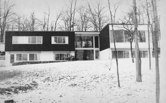 View of the house from the lakefront, with decorated Christmas tree in the entrance hall. 1955, courtesy Liz Buckner.
