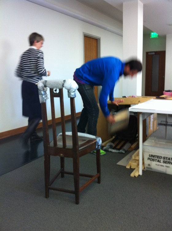 One of two Cranbrook School Dining Hall chairs being unpacked in the Center offices, November 2012. 