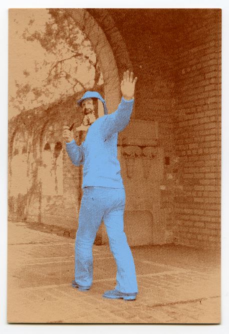 Limited edition postcard featuring CAA student Jim Poole wearing a Cage Bag as a mask on Cranbrook's campus, 1974. Courtesy Stephen Milanowski. 