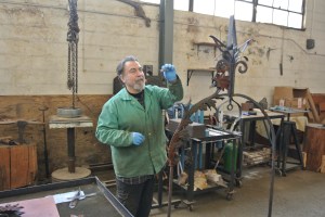 Giorgio Ginkas explaining the conservation process for the Wishing Well. Courtesy Cranbrook Archives.