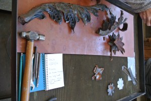 Parts of the Wishing Well “arch” removed for restoration. One element was missing so a replacement piece had to be fabricated. Courtesy Cranbrook Archives.