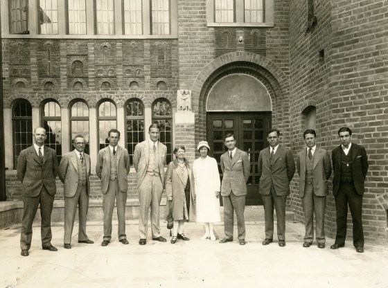 From left to right: Charles Keppel (Chemistry), John M. Harlow (French), George T. Mickelson (English), Herbert Snyder, Elizabeth Bemis (Dietician), Estelle Adams, (Nurse), William O. Stevens, Unidentified, C. Warren Moore (Arts & Crafts), Howard Yule (Latin)