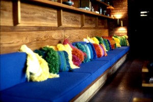 Slide of Andrea Arens's pillows on display on the bench in Smith House. Courtesy Arens Family.