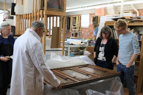Ken Katz, Mrs. Mio, and Mr. Adkisson discuss restoration plans for the painting on wood panels— Flora, Ceres, Pomona (Three Goddesses) by Corrado Scapecchi.