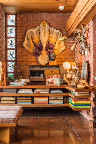 The "entertainment center" of the Smith House, with its GE Stereophonic High-Fidelity Turntable and records stacked three deep on shelves added below the desk in the late 1960s. Hassocks in the foreground. Photo Cranbrook Center for the Collections and Research | Brett Mountain for SEEN Magazine.