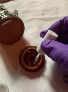 Numbering a jar in Smith House. Photo by author.